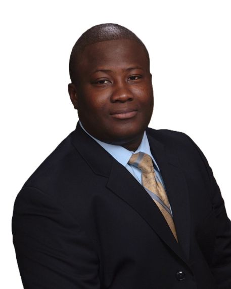 A man in a dark suit, light blue shirt, and gold tie poses against a plain white background, looking at the camera with a slight smile—a professional image suitable for Renal Associates.